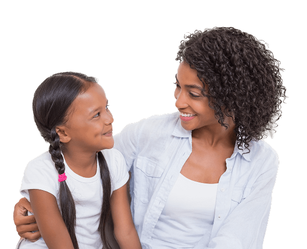 A mother and daughter smiling at each other