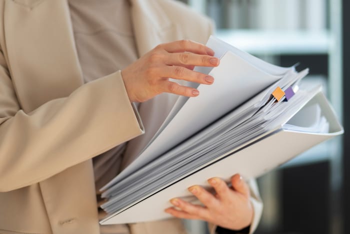 A team member organizing insurance paperwork