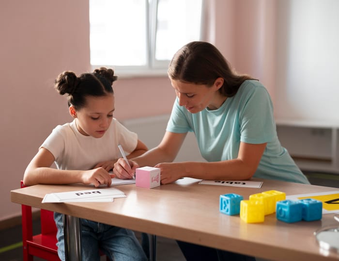 A clinician working one-on-one with a young girl